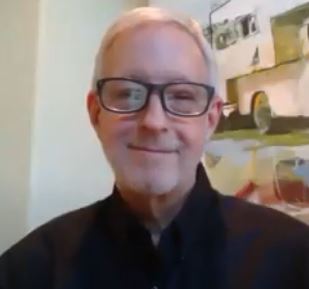 Screen shot of John Boyle in glasses over Zoom leading an online Guided Meditation based on Science of Mind Philosophy